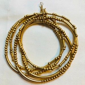 5 strand, gold tone, stretch bracelet.